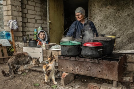 A family cook outside the basement of their house