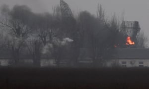 Fire is seen coming out of a military installation near the airport in Mariupol, eastern Ukraine