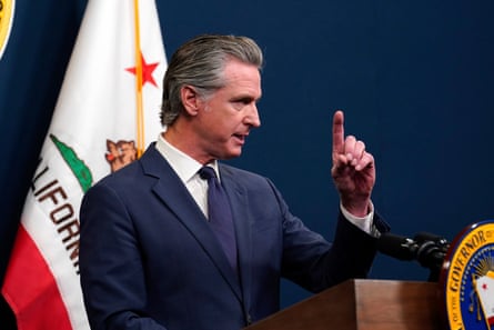 Man at podium waves finger in air