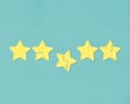 5 gold stars in a row, slightly broken.