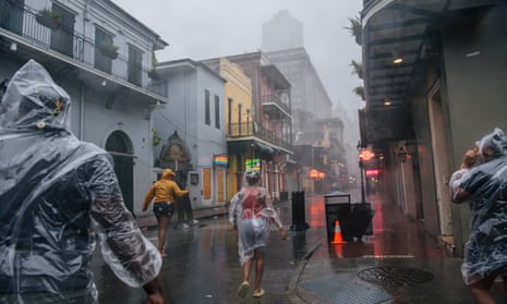 A group of people walk through the French District during Hurricane Ida in New Orleans, Louisiana. Hurricane Ida made landfall earlier today and continues to cut across Louisiana. Hurricane Ida has been classified as a Category 4 storm with winds of 150 mph.