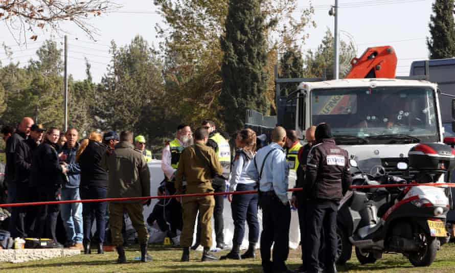 Israeli security forces and medics gather at the site of the attack in Jerusalem.