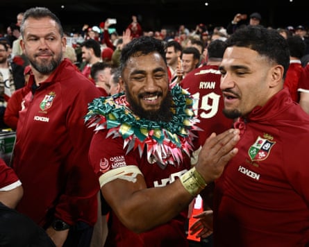 Bundee Aki celebrates the series win as victorious coach Andy Farrell (left) looks on
