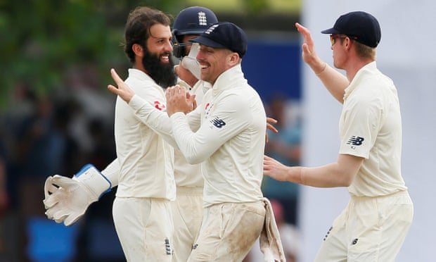 England’s Moeen Ali celebrates with Jack Leach and Keaton Jennings after taking the wicket of Niroshan Dickwella.