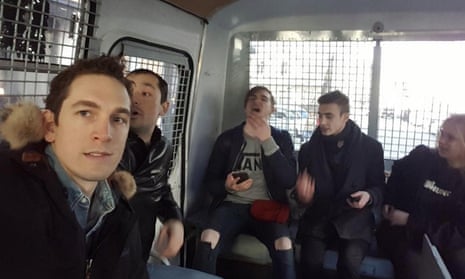 Alec Luhn with other detainees inside the police van.