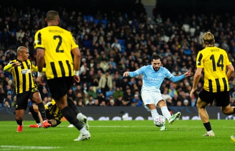 Rayan Cherki strikes the ball, scoring Manchester City's third goal in the match