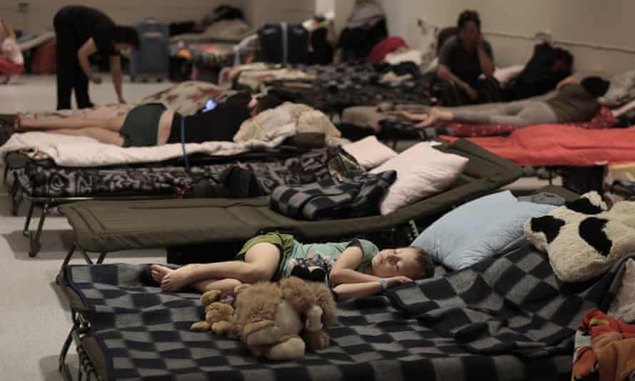 Ukrainian refugees sleep in a hostel, in a disused shopping centre, near the centre of Krakow, Poland.