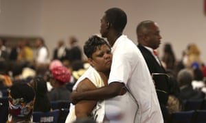 Alicia Grayson, the mother of 18-year-old Nia Wilson, who was stabbed to death at a train station, is embraced during her daughter’s funeral in Oakland, California, on Friday.