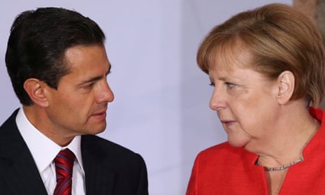 Angela Merkel speaks with Mexico’s president, Enrique Peña Nieto, in Mexico City.