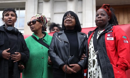Diane Abbott standing with a group of other women in the street