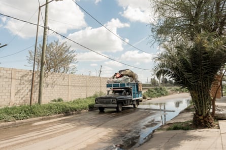 A private truck loading waste in José León Suárez, Buenos Aires province, Argentina