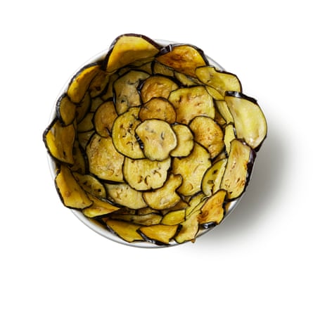 Felicity Cloake’s Timballo 07a. Line and fill the tin Securely wrap the base of a loose-bottomed cake tin in foil and put it inside a larger baking tin in case of leakage. Use the aubergine slices to line the entire insides of the tin, arranging them so they overlap the rim.