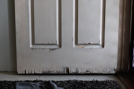 Bottom of a front door with obvious water damage
