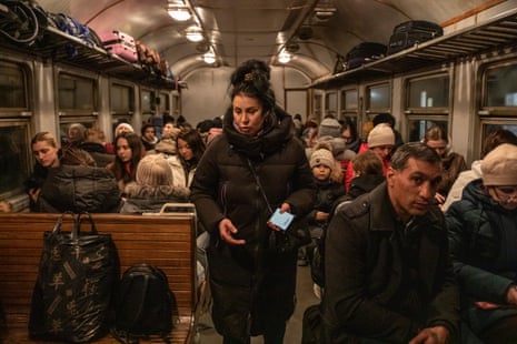 A woman inside a train in Lviv waiting for the train to leave to Przemyśl in Poland.