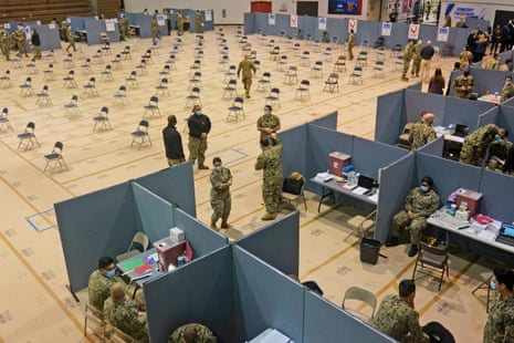 Military personnel prepare for the opening of a Fema-run mass vaccination site in Queens, New York. At the Fort Bragg base in North Carolina, acceptance rates for the vaccines are below 50%.