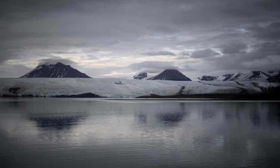 A view of Nordenskiold glacier melting and collapsing in the ocean, near Pyramiden, in Svalbard, a northern Norwegian archipelago on September 21, 2021