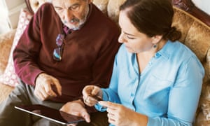 Older man online on tablet with daughter