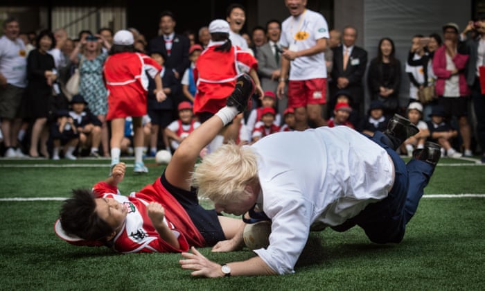 Boris Johnson Knocks Over 10 Year Old During Rugby Game In Japan Politics The Guardian