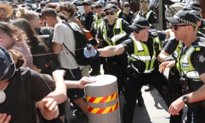 Police use pepper spray against protesters.