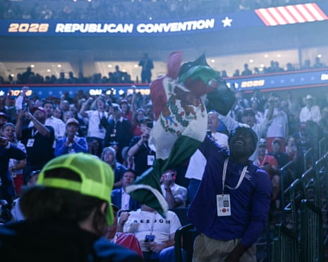 A protestor throws a Mexican flag as JD Vance speaks during the second day of the Republican Convention in Dallas.