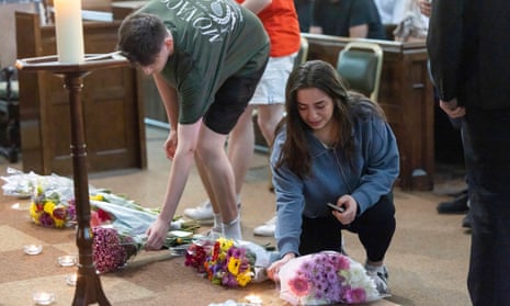 Mourners gather at St. Peters Church in Nottingham city centre for a vigil and to lay flowers and light candles for the people killed in the attack