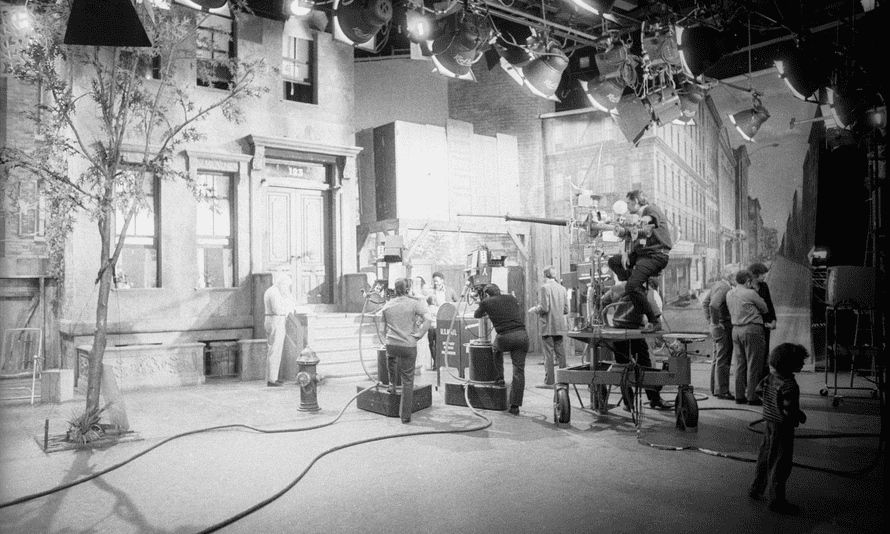 Filming on the set of Sesame Street.