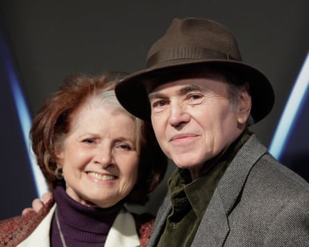 Walter Koenig in a fedora poses closely with Judy Levitt, both smiling