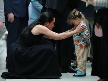 Meghan, the Duchess of Sussex, meets a young child during a visit to the Royal Children’s Hospital.