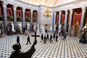 House impeachment managers walk through National Statuary Hall on their way to the Senate chamber for the start of the Senate impeachment trial against former US President Donald J Trump on Capitol Hill.