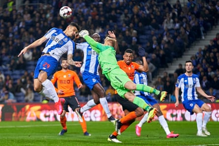 The Rio Ave goalkeeper Pawel Kieszek competes for the ball with Porto’s Tiquinho Soares during the game on 7 March