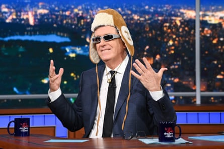 man in suit wearing a hat and sunglasses
