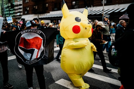 A demonstrator wears an inflatable costume depicting the Pokémon character Pikachu in New York City.