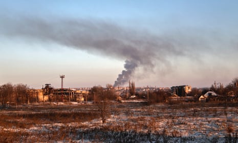 Smoke rises after shelling in Soledar, the site of heavy battles with Russian forces in the Donetsk region, Ukraine, Sunday, Jan. 8, 2023. (AP Photo/Roman Chop)