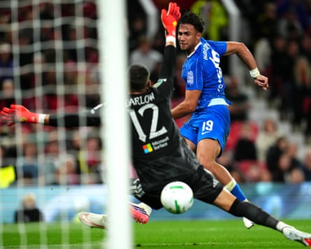 The Brighton striker Charalampos Kostoulas shoots past the Manchester United goalkeeper Karl Darlow to score his team's first goal in their 3-2 win in the Carabao Cup third round at Old Trafford.