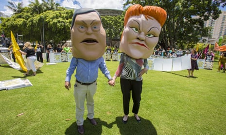 Protesters dressed as caricatures of Tim Nicholls and Pauline Hanson in Brisbane on Tuesday