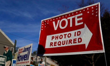 A sign in Arlington, Virginia, on 5 November 2019. Kentucky approved a new photo ID requirement that makes it harder to vote. 