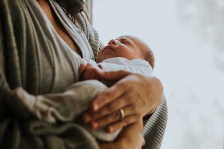 A mother holding her baby