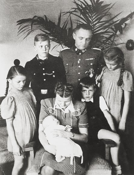 The Höss family in the Auschwitz villa, 1943. Anticlockwise from left: Brigitte, Hedwig holding Annegret, Hans Jürgen, Heidetraud, Rudolf and Klaus.
