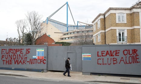 Supporter feeling is daubed on hoardings close to Stamford Bridge.