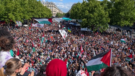 People gather in Paris to show solidarity with Palestine.