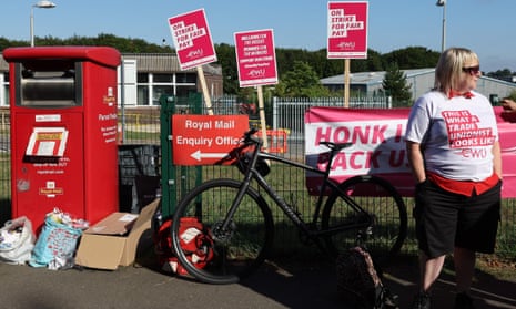 A Royal Mail worker at a picket line outside the company’s Basingstoke delivery office.