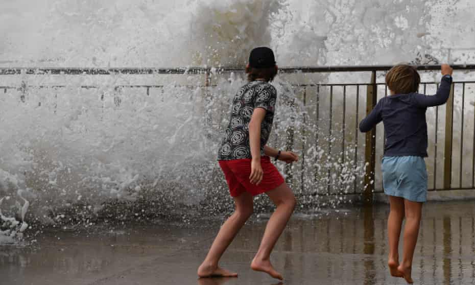 Large waves pound the promenade and ocean baths at Bronte Beach in Sydney