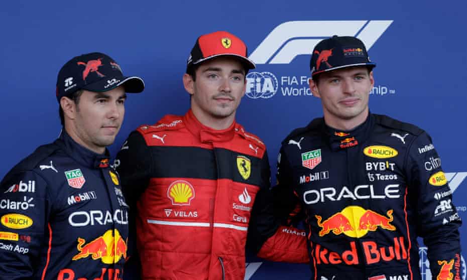 Charles Leclerc celebrates after winning pole position ahead of Red Bull's Sergio Pérez and Max Verstappen