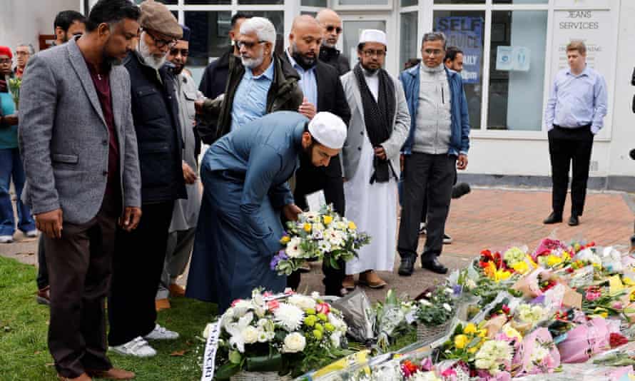 Members of the Muslim community lay floral tributes at the scene of the fatal stabbing of David Amess.