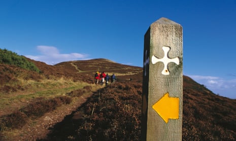 Saintly progress … walkers on St Cuthbert’s Way at Eildon Hill, south of Melrose.
