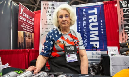 NRA member Linda Schillinger sits in her booth at the NRA convention in Dallas, Texas.