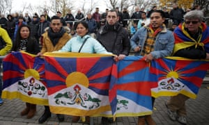 Spectators raise Tibetan flag to protest China’s politics regarding Tibet at a football match between TSV Schott Mainz and China’s U20 team.
