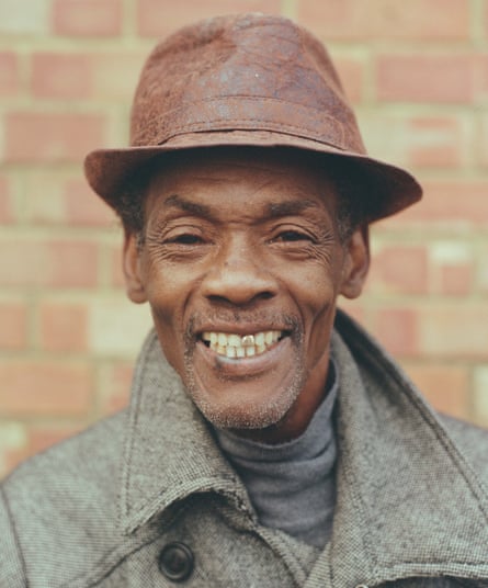 Vanriel with broad smile, trilby, gold tooth