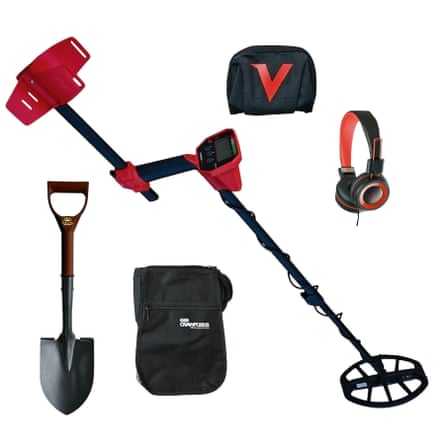 Black and red metal detector with various accessories