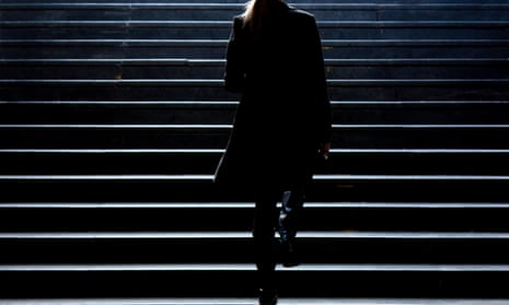 Silhouette of a woman walking up some stairs